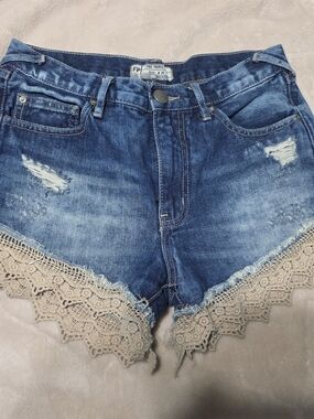 Free People Dark Blue Distressed Denim Shorts with Cream Crochet Trim